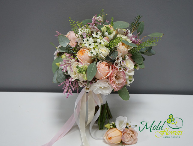 Bridal bouquet with pink roses, eustoma, and eucalyptus + boutonniere photo